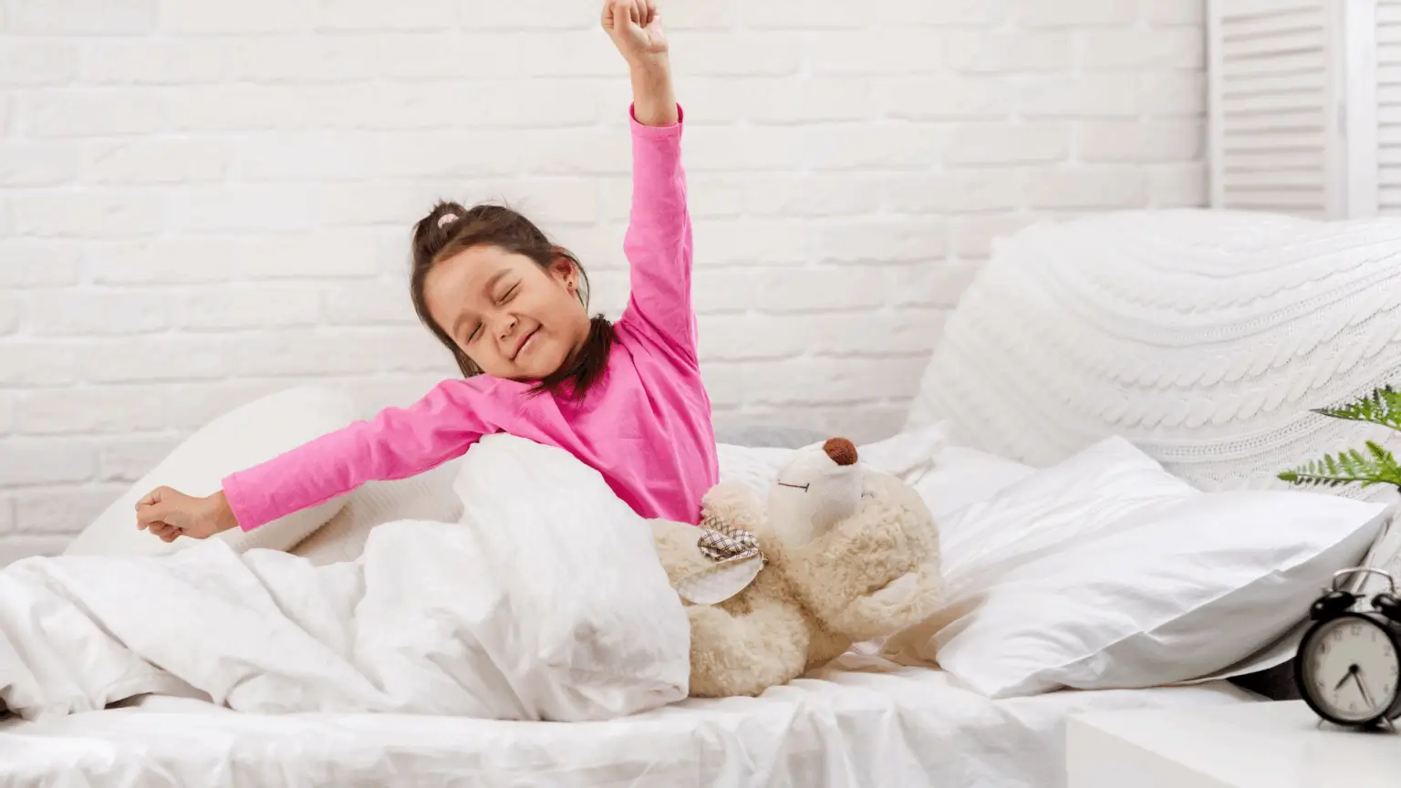 Child waking up in bed single mattress